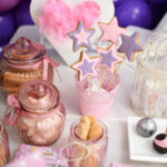 Candy bar with a lot of different candies and sweet cakes